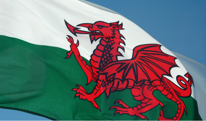 A Welsh flag blowing in the wind