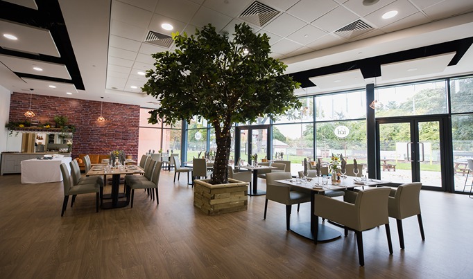 ial Restaurant, empty, with all tables set up ready for service