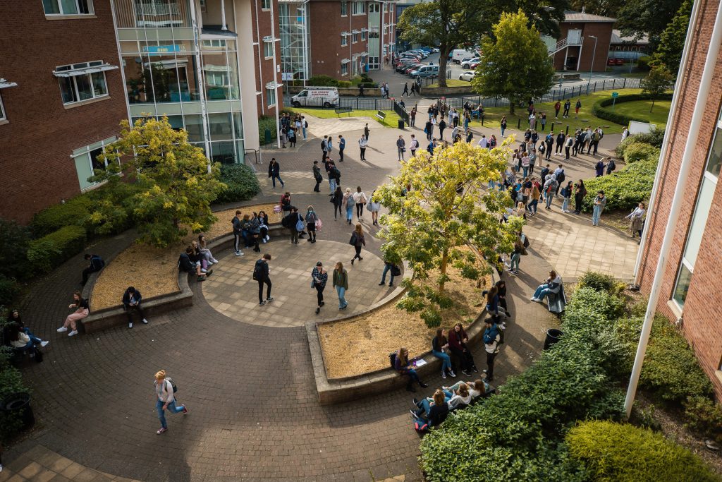 A view of many Yale Sixth Form students from above outside