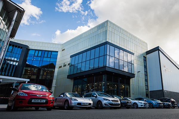 The Hafod building at Yale in Wrexham with cars in front