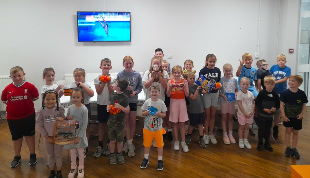 A group of primary school students who enjoyed a sporty summer with Coleg Cambria