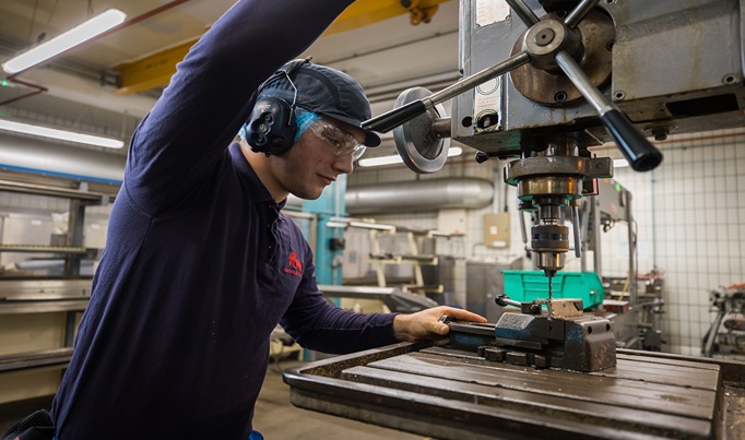 An engineering apprentice who works for Kelloggs operating machinery