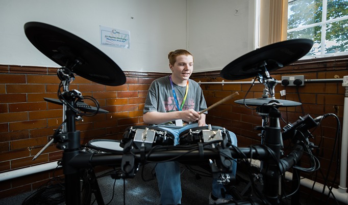 A Music Performance student playing the drums