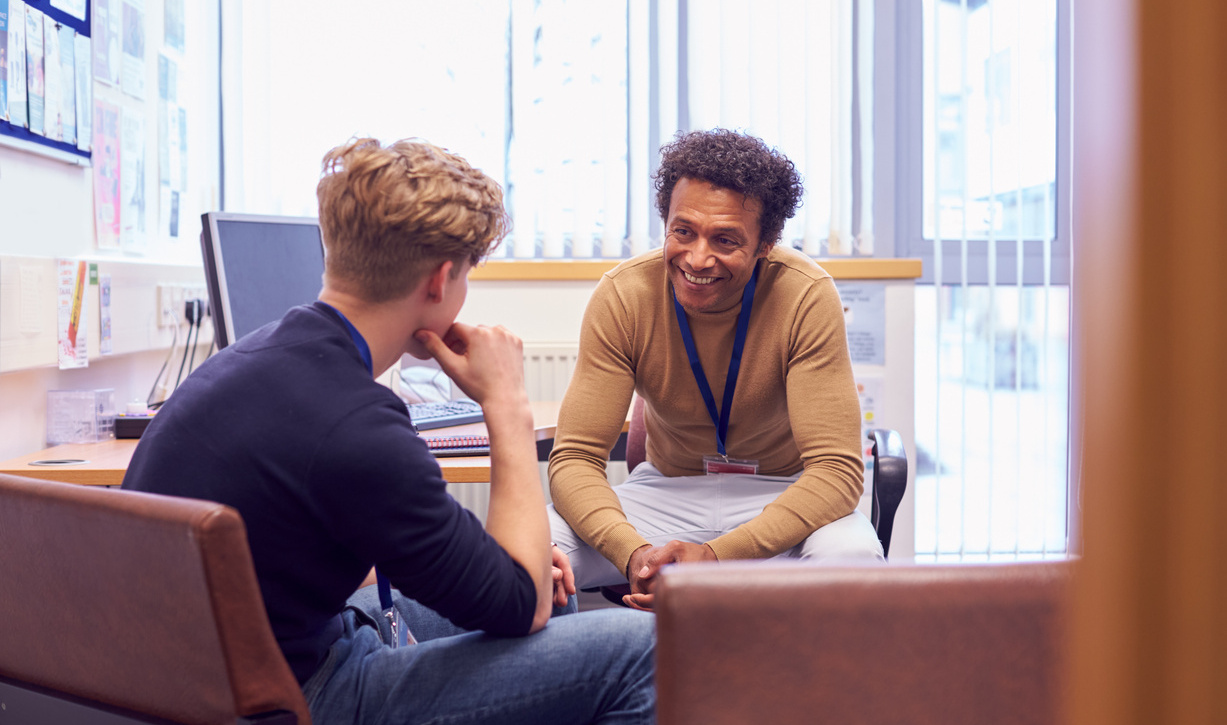 Adult learner speaking privately with a member of staff