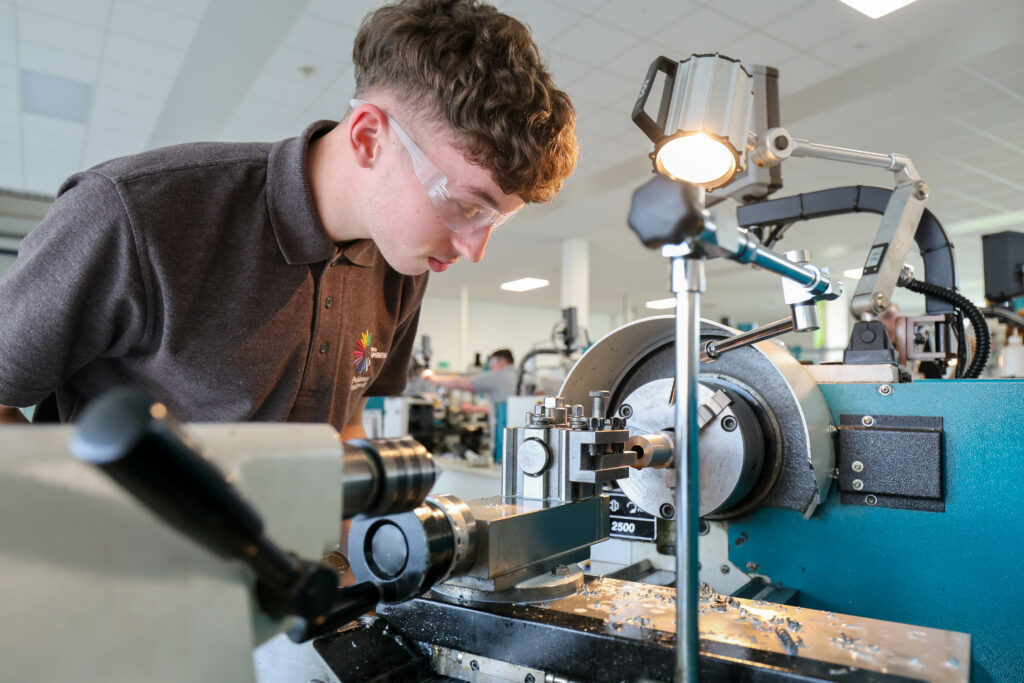 a learner looking at engineering equipment