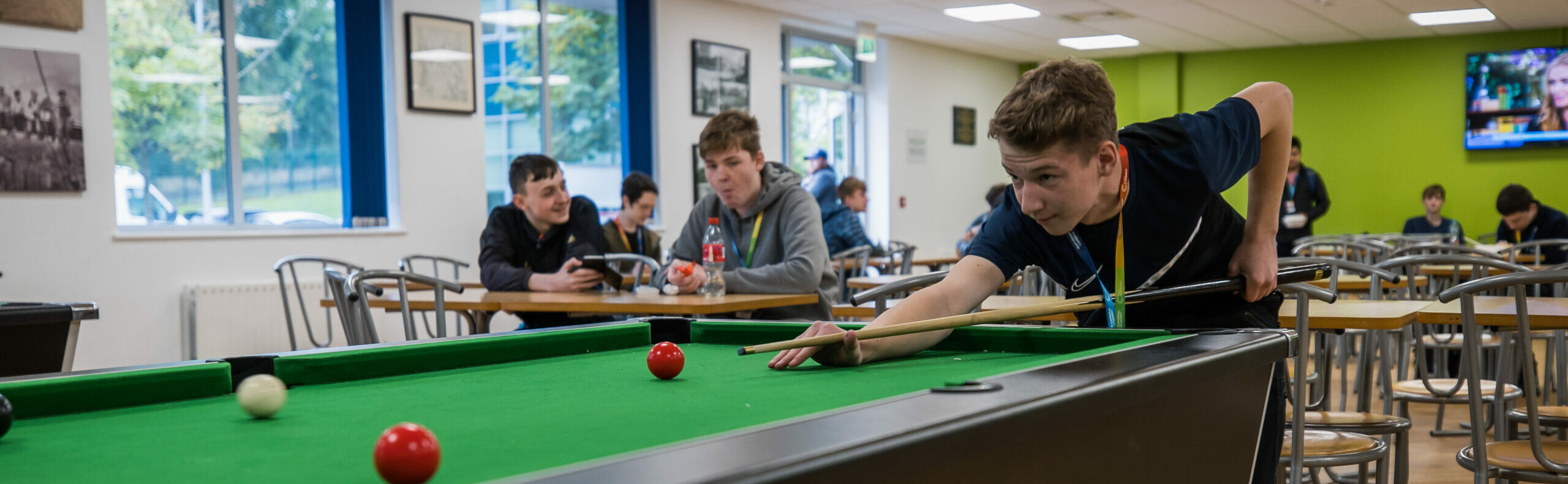 learners playing pool in the common room