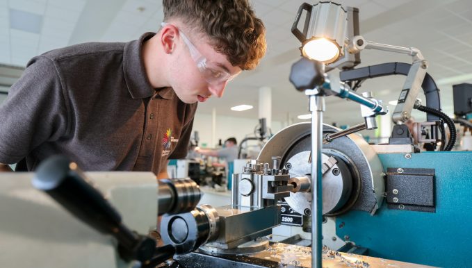 a learner looking at engineering equipment