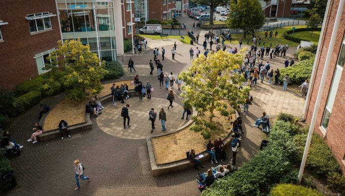 A view of many Yale Sixth Form students from above outside