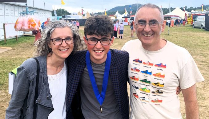 Rufus Edwards 
(centre) celebrating the week of a lifetime by passing his A Levels and winning a prestigious music prize.